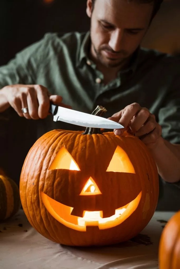 A Photo Of A Man Carving A Pumpkin For H Mucr Yk8sks8ol7wezmsgq 68r93guht0gdar Fm9tolw