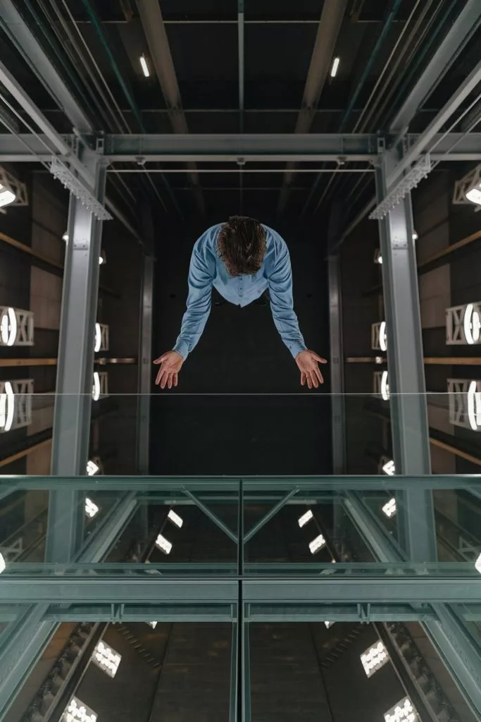 A Photo Of A Person Standing On A Glass Oibqiocns22rbqrhl0n8rg Sfj7wegtqvcup1qnibepxq