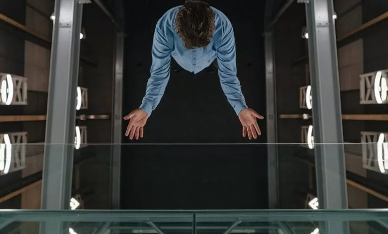 A Photo Of A Person Standing On A Glass Oibqiocns22rbqrhl0n8rg Sfj7wegtqvcup1qnibepxq