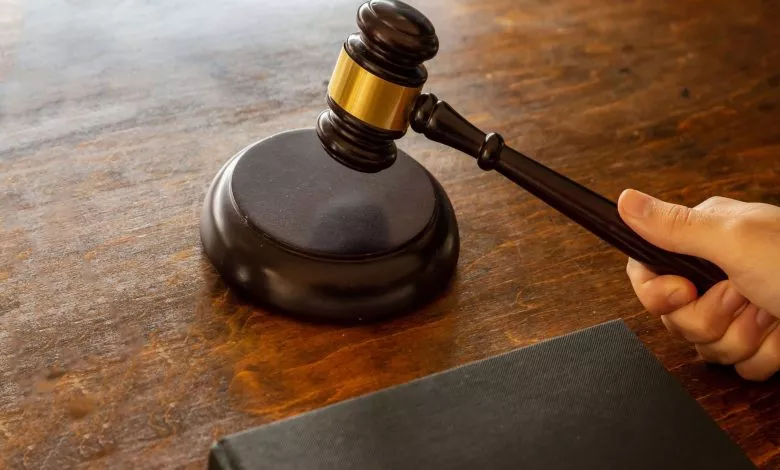 Judge Hitting A Gavel On Wooden Desk Background Bcaalmf Min 2 Scaled 1