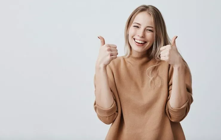 Portrait Fair Haired Beautiful Female Woman With Broad Smile Thumbs Up 176420 14970