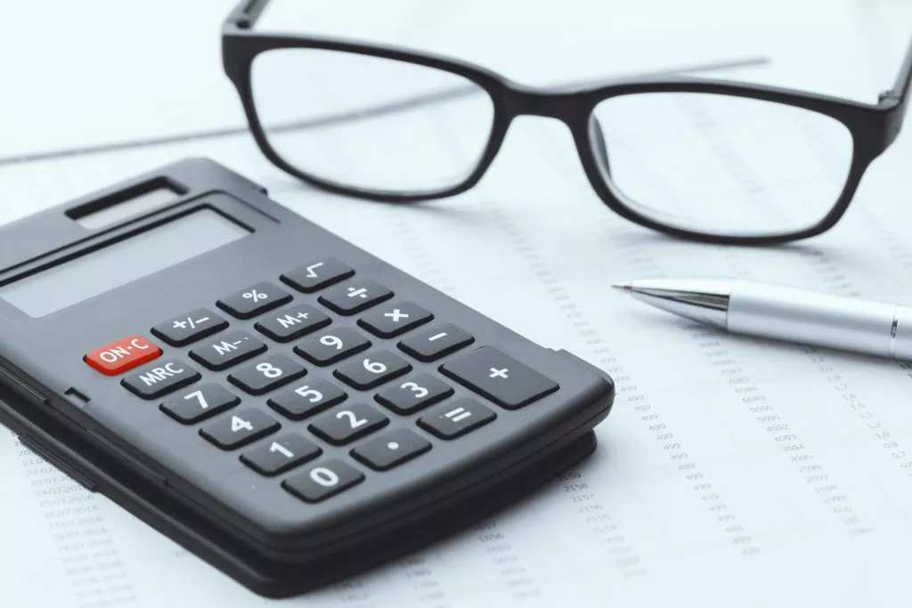 Business Still Life With Calculator On Table In Of K3xm2fh Scaled 1
